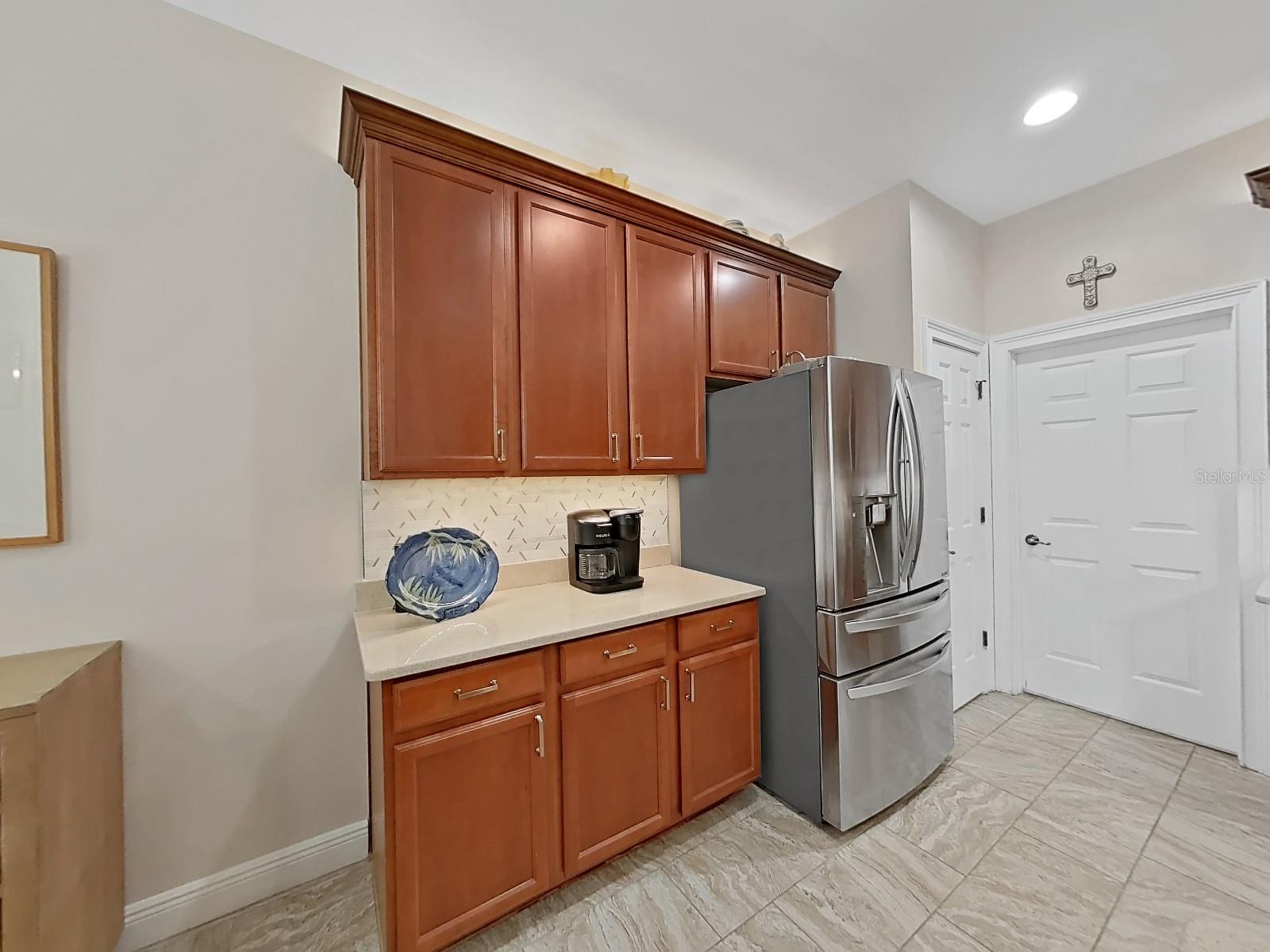 French door refrigerator with upper door opening without opening entire unit. Multiple freezer drawers. Water and ice ready to go!