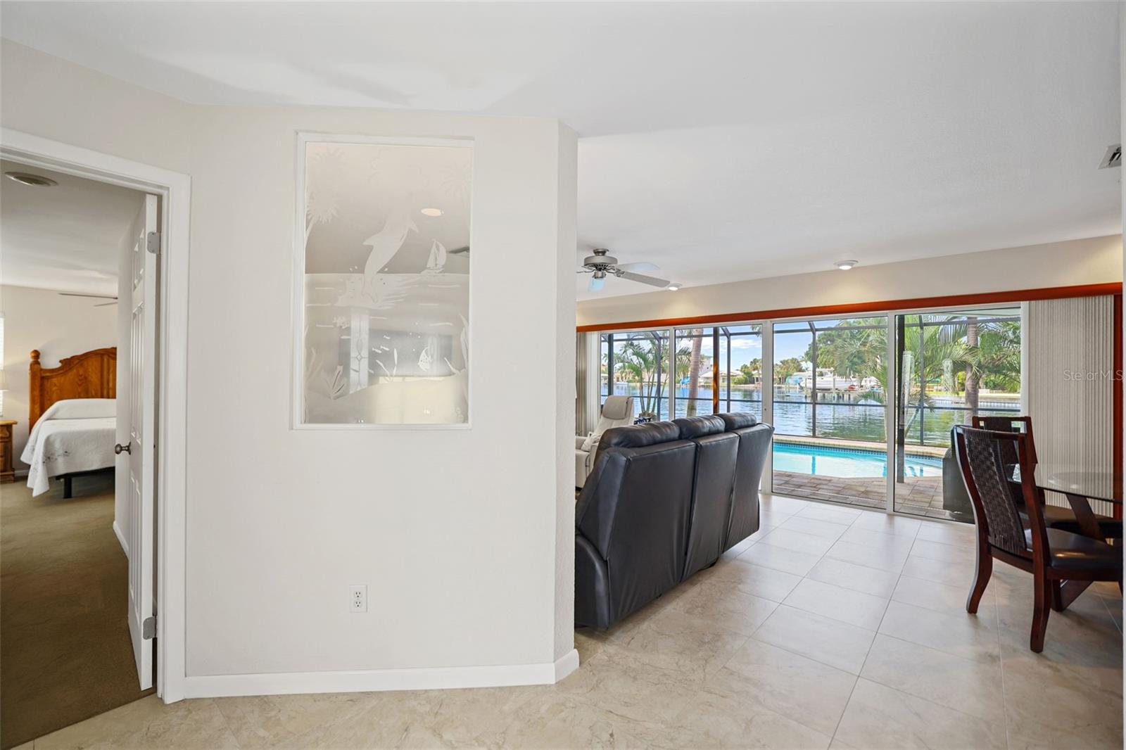 Open Concept Living/Dining Room Overlooking Pool & Water