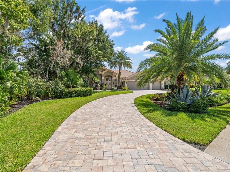 Follow the newer pavers to your exquisite home!