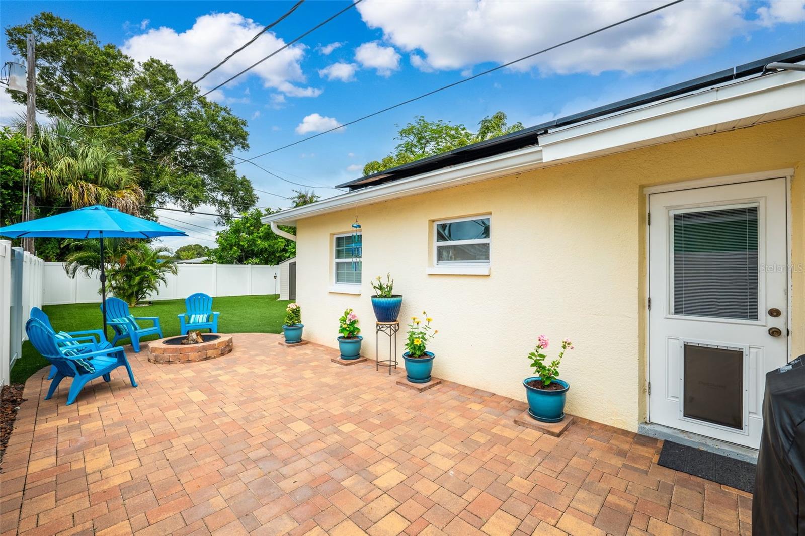 Spacious paver patio with fire pit and plenty of space to entertain.