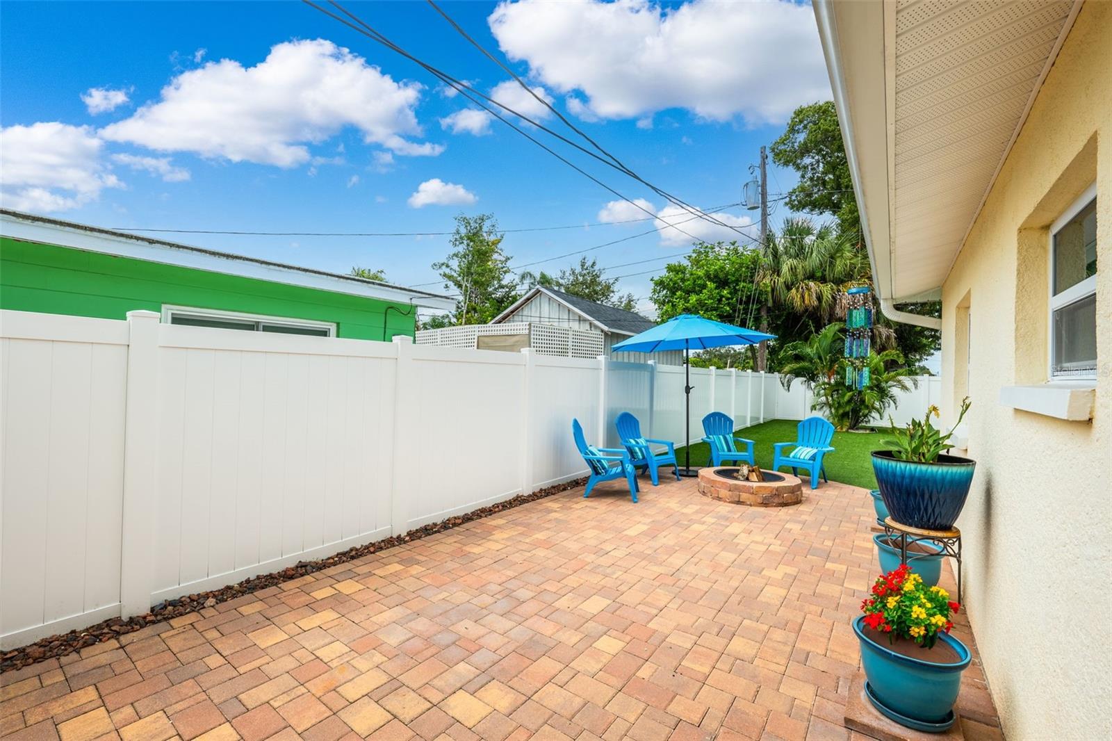 Spacious paver patio with fire pit and plenty of space to entertain.