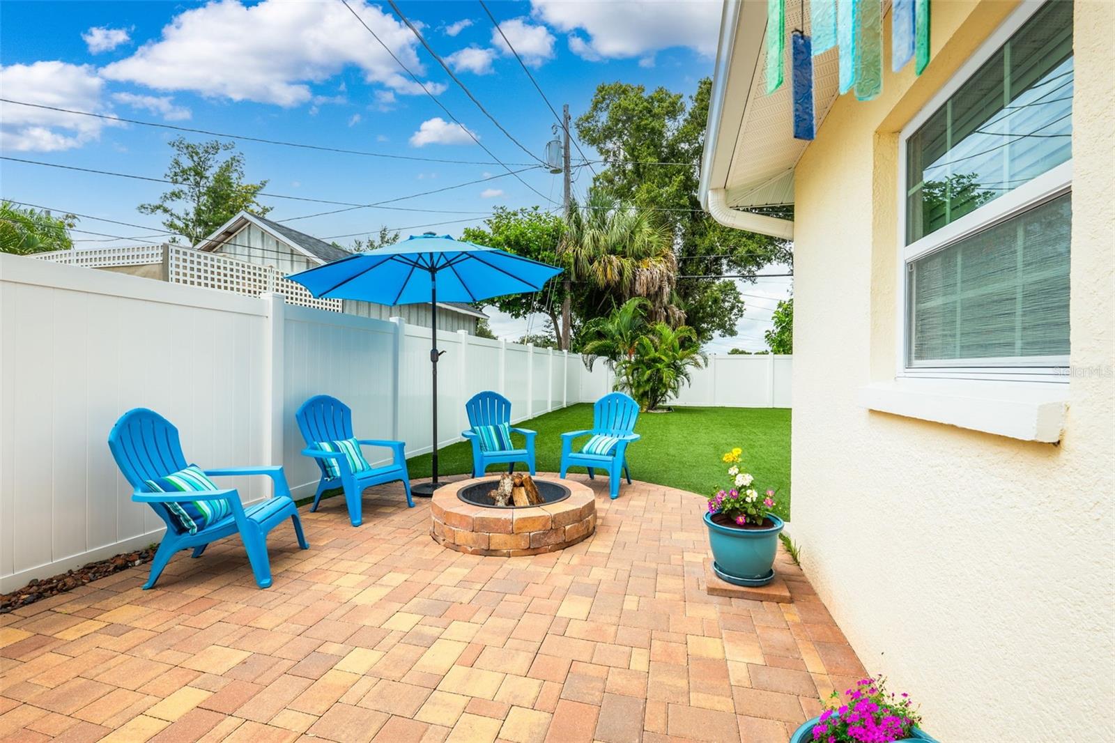 Spacious paver patio with fire pit and plenty of space to entertain.