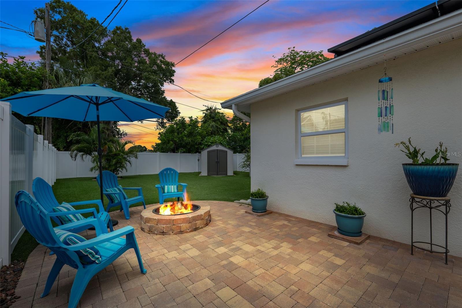 Spacious paver patio with fire pit and plenty of space to entertain.