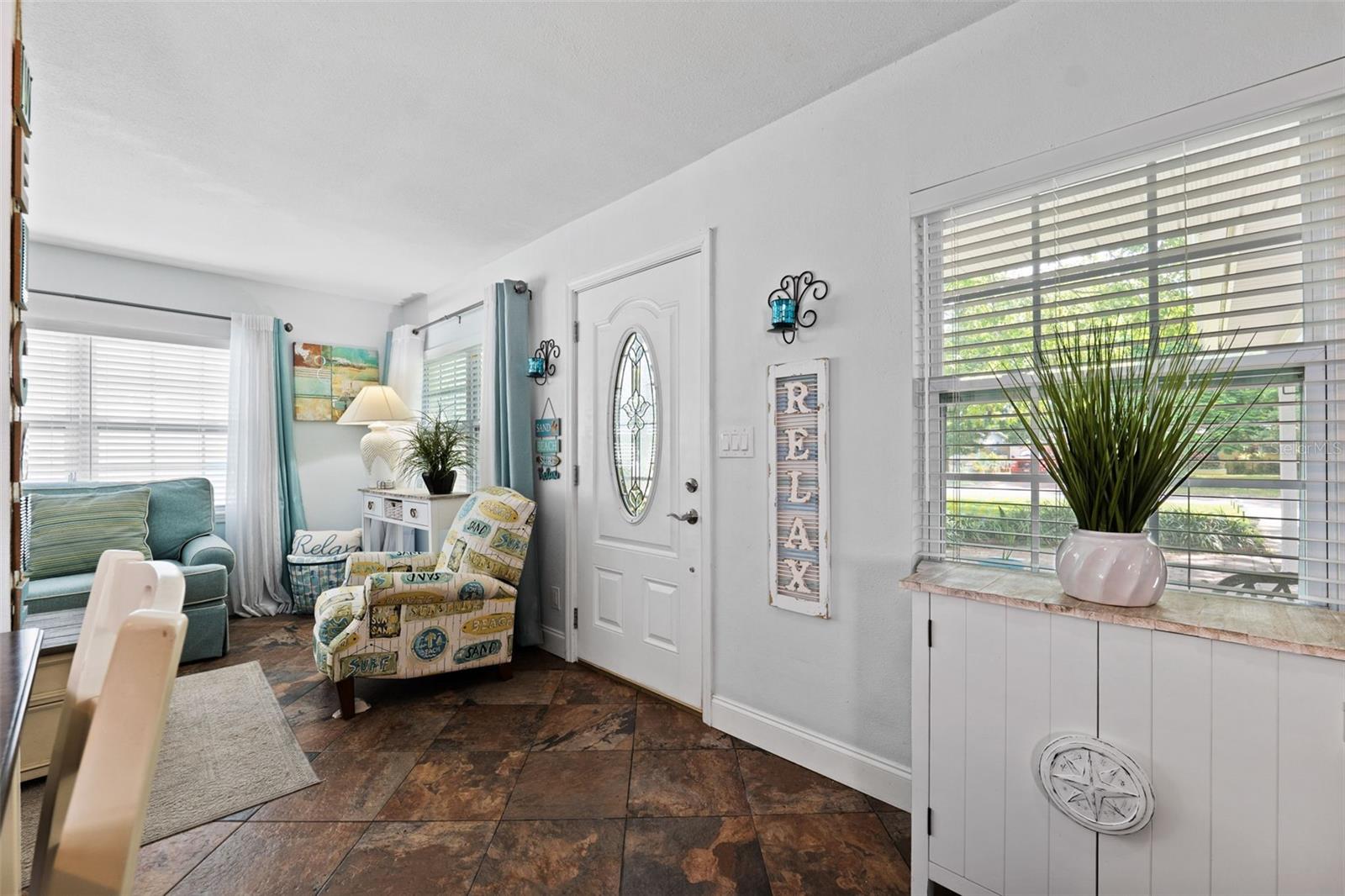 Newer windows allow light to fill the living room and kitchen