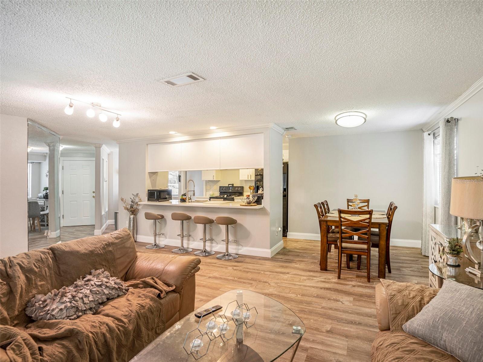 View of great/living room, dining, kitchen, hallway