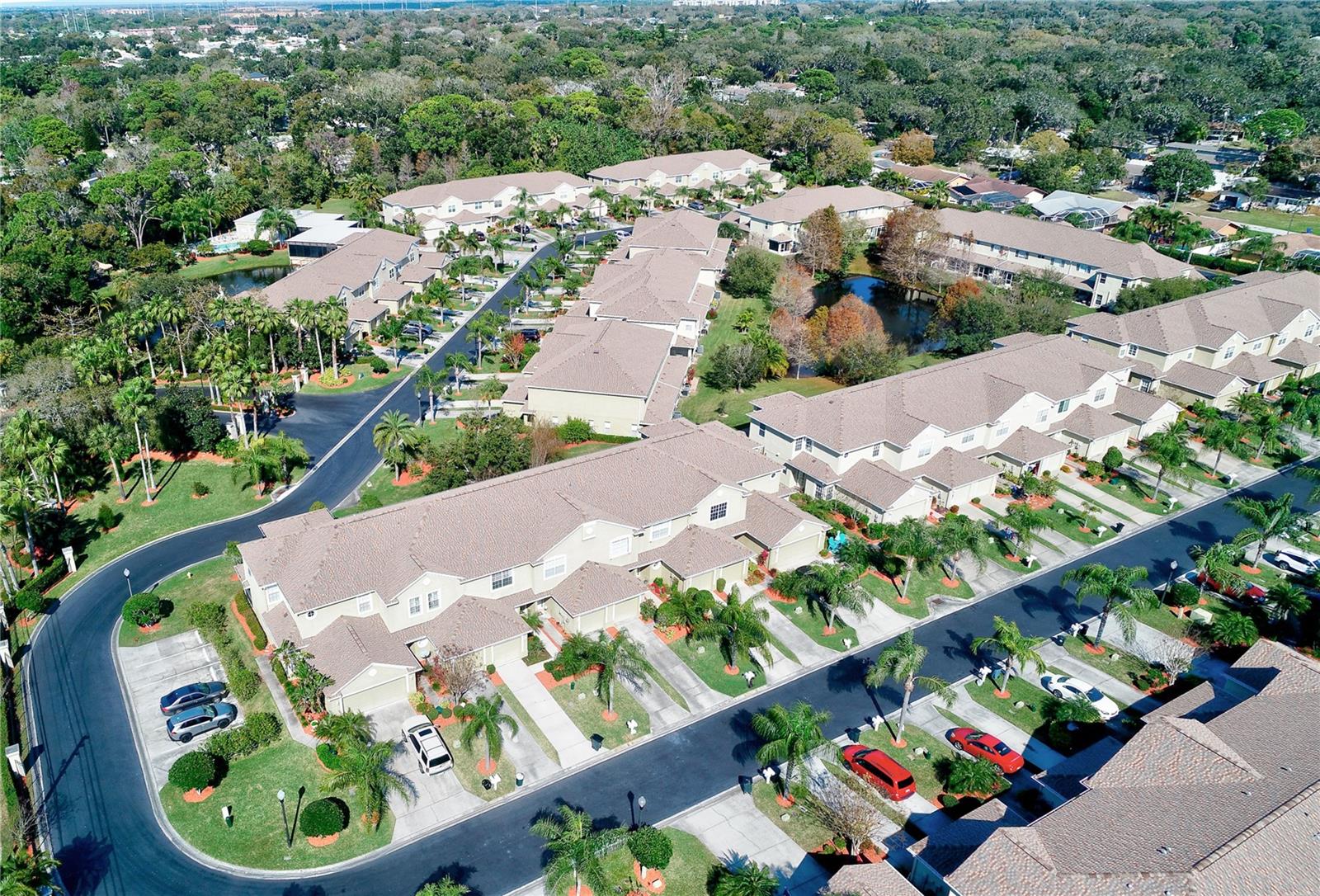 Aerial of community looking North, townhome in Upper Left building