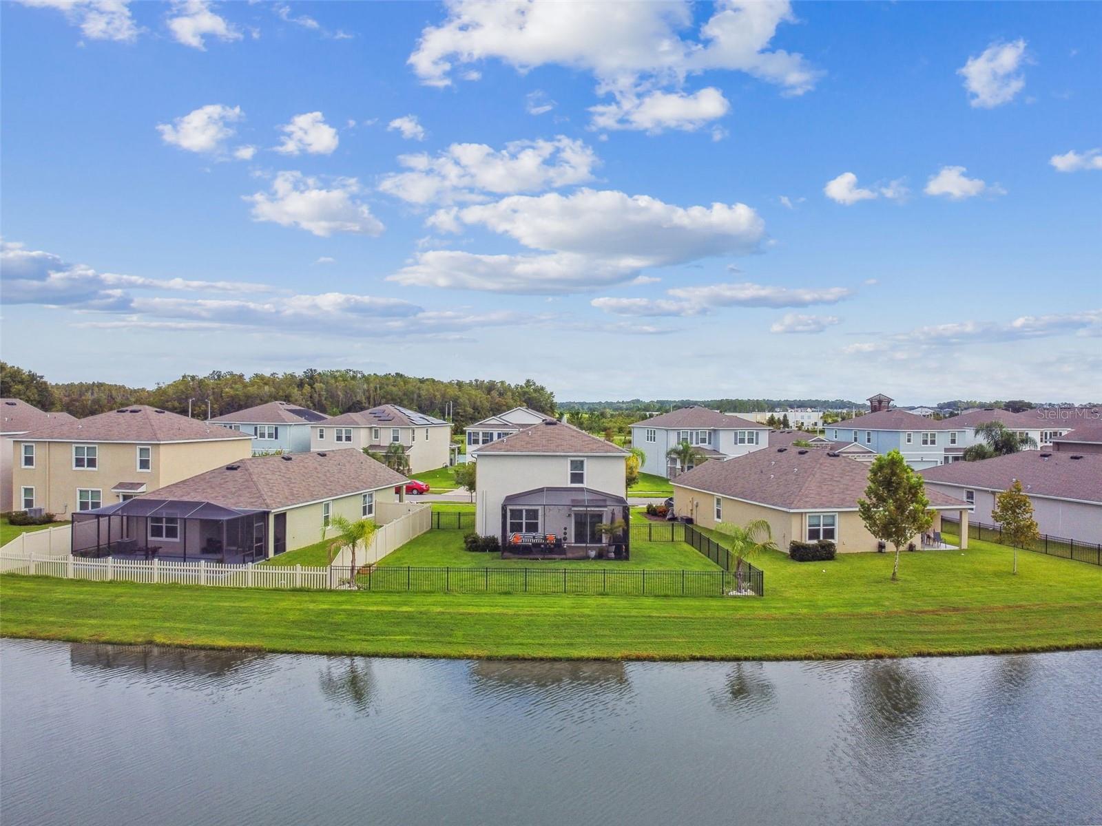 Rear view of home over pond