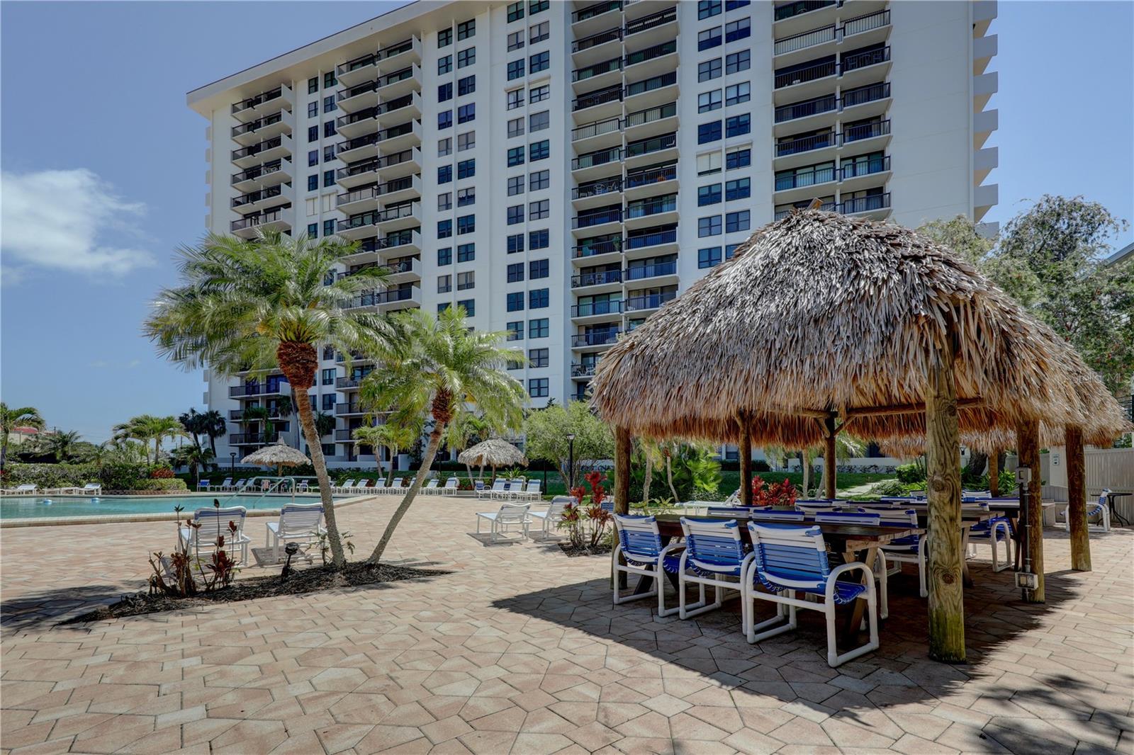 Inviting Tiki Picnic area; great for grill outs. Gas grills on pool deck area for use.