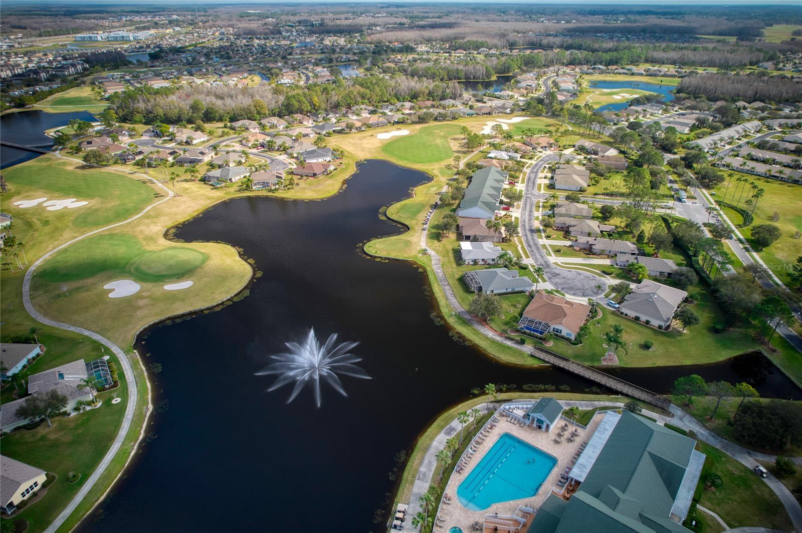 This Gated community has a heated pool, tennis, pickleball, shuffleboard courts and a woodworking room.