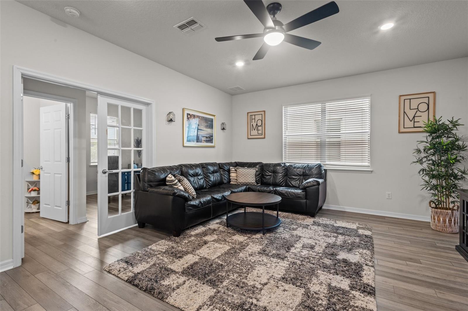 Living Room - Doors Lead to Office/4th Bedroom and Half Bath