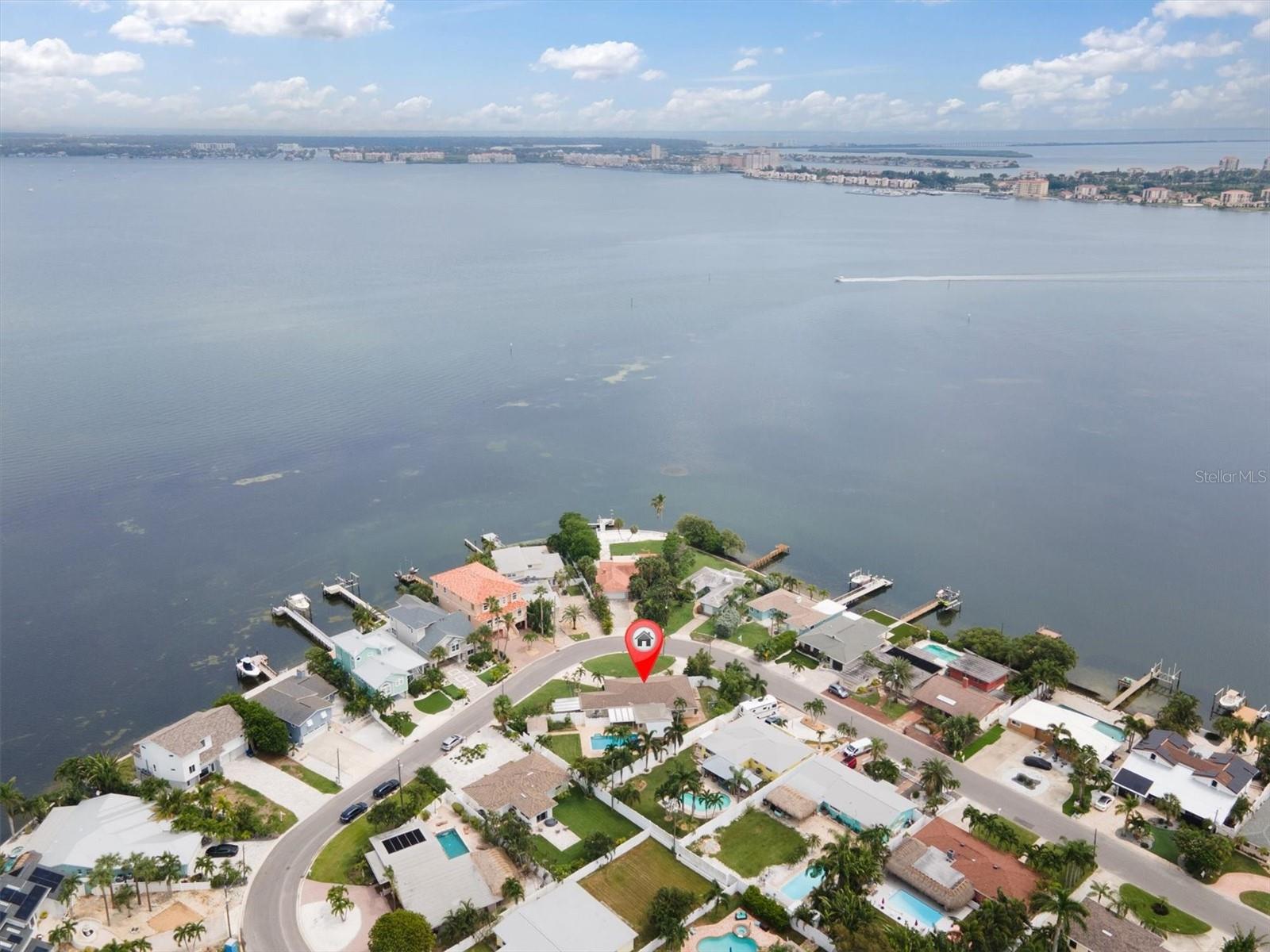 Arial shot showing the double lot, large backyard and saltwater pool