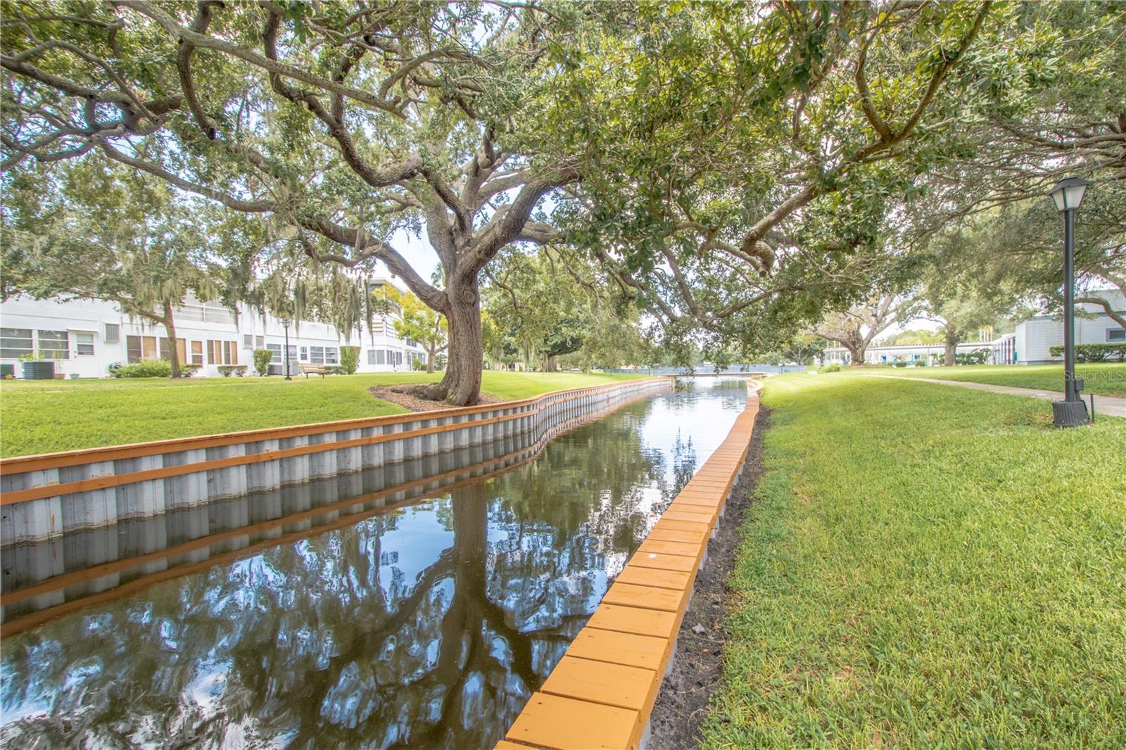 A lovely canal like backdrop adds to the serene atmosphere.