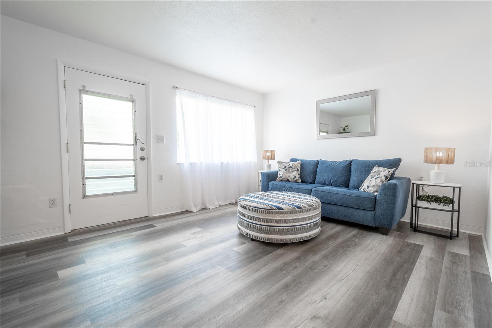 The front door features frosted glass letting light in while maintaining privacy.