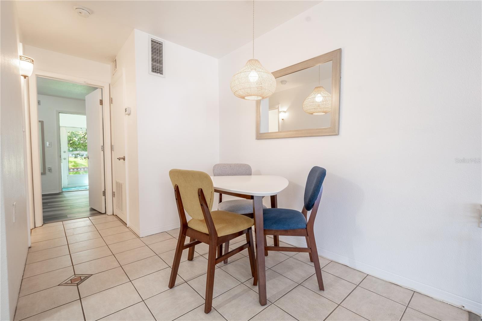 The dinette features ceramic tile flooring and neutral tone walls.