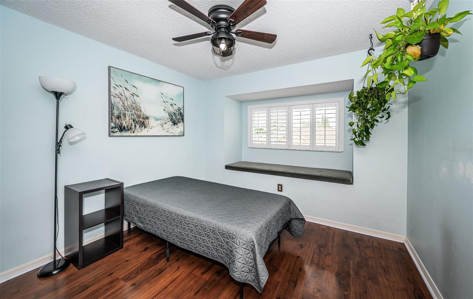 Upstairs Bedroom #3 - plantation shutters, impact rated window and window seat