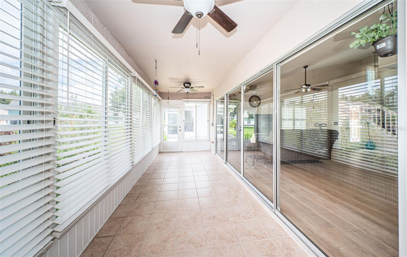 Bright, spacious enclosed lanai - ceramic tile floors