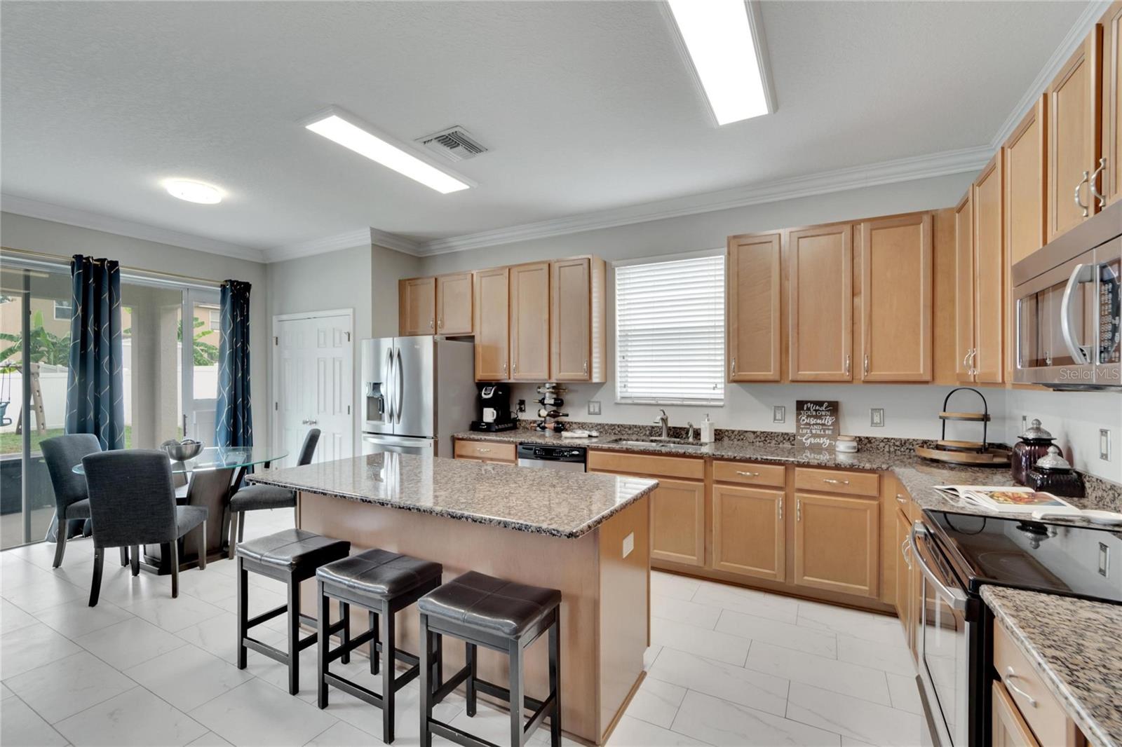 Look at this Kitchen and the granite breakfast bar.