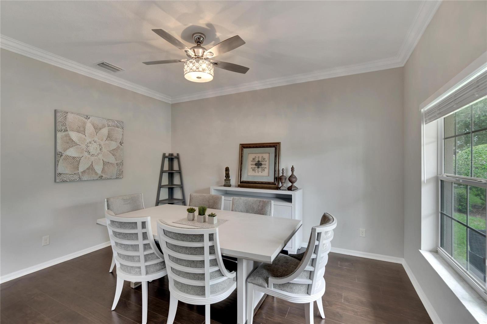 Formal Dining Room with beautiful lighting and crown molding.