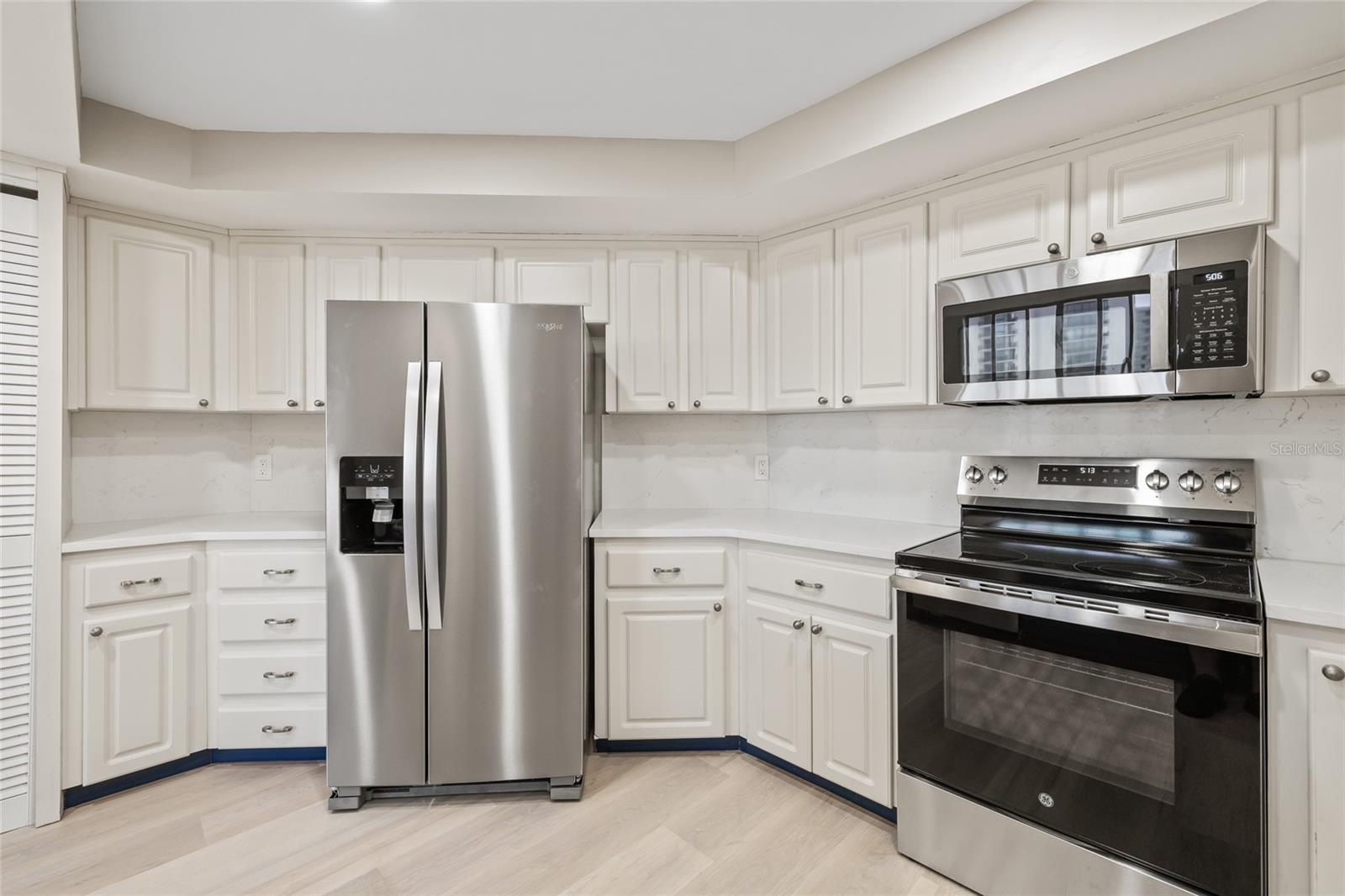 New Stainless Steel appliances and Quartz Countertops. Popcorn ceiling removed and new lighting installed.