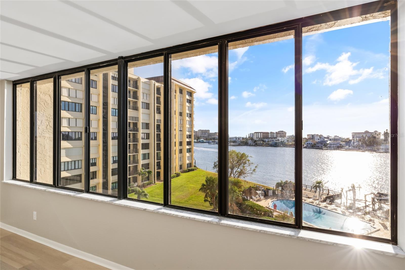 New Windows will be installed with a picture window and hurricane impact windows. Beautiful views through entire living area