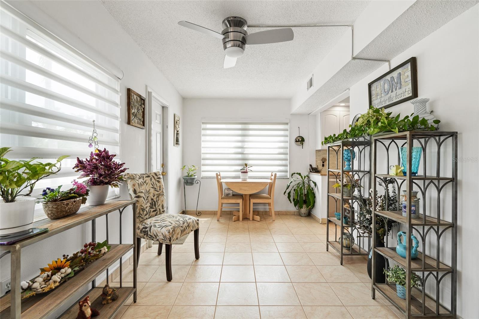 Family room, stylish blinds, exterior door to the left, the covered parking is right outside this door.