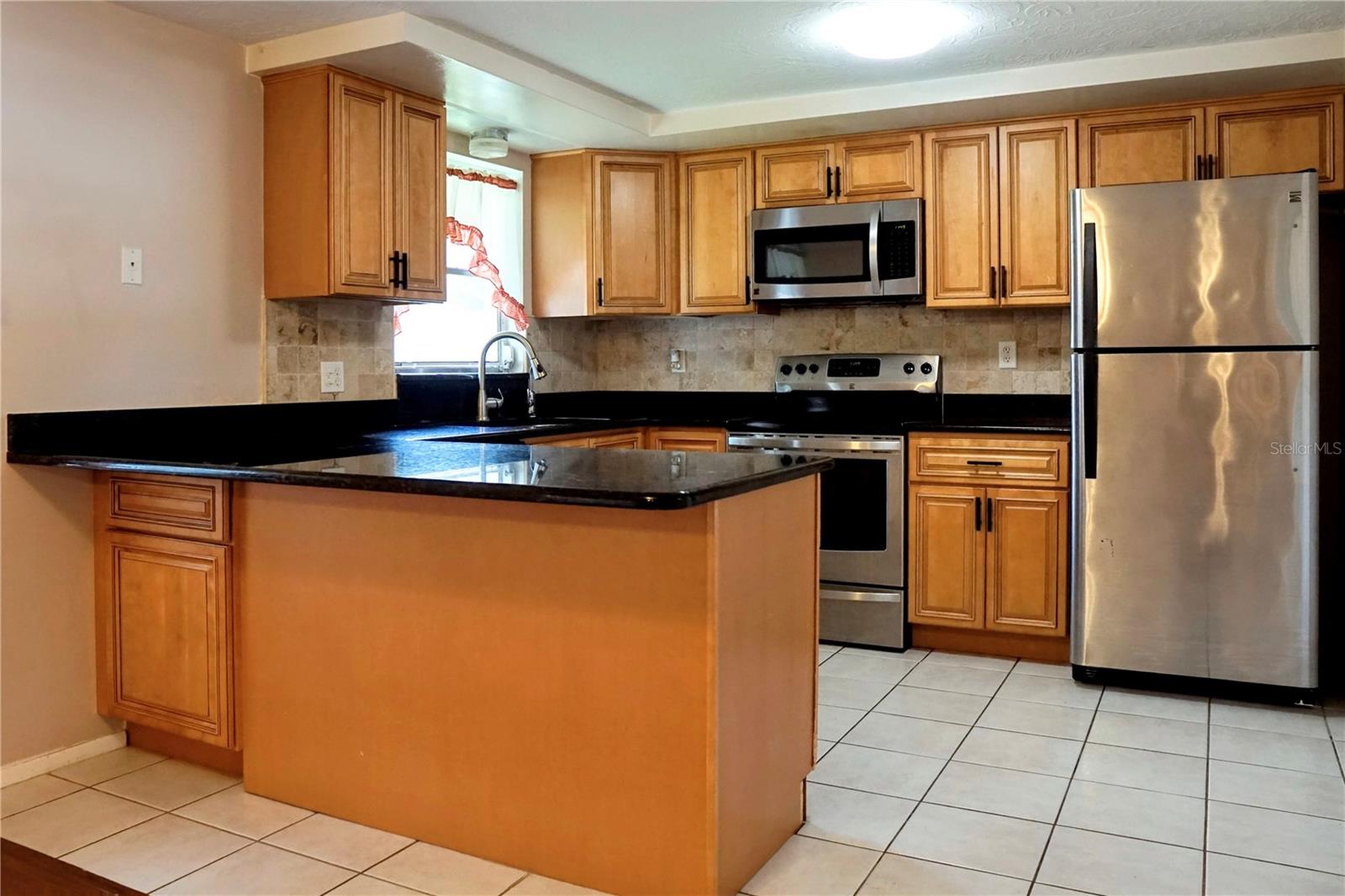 Large kitchen with stainless steel appliances