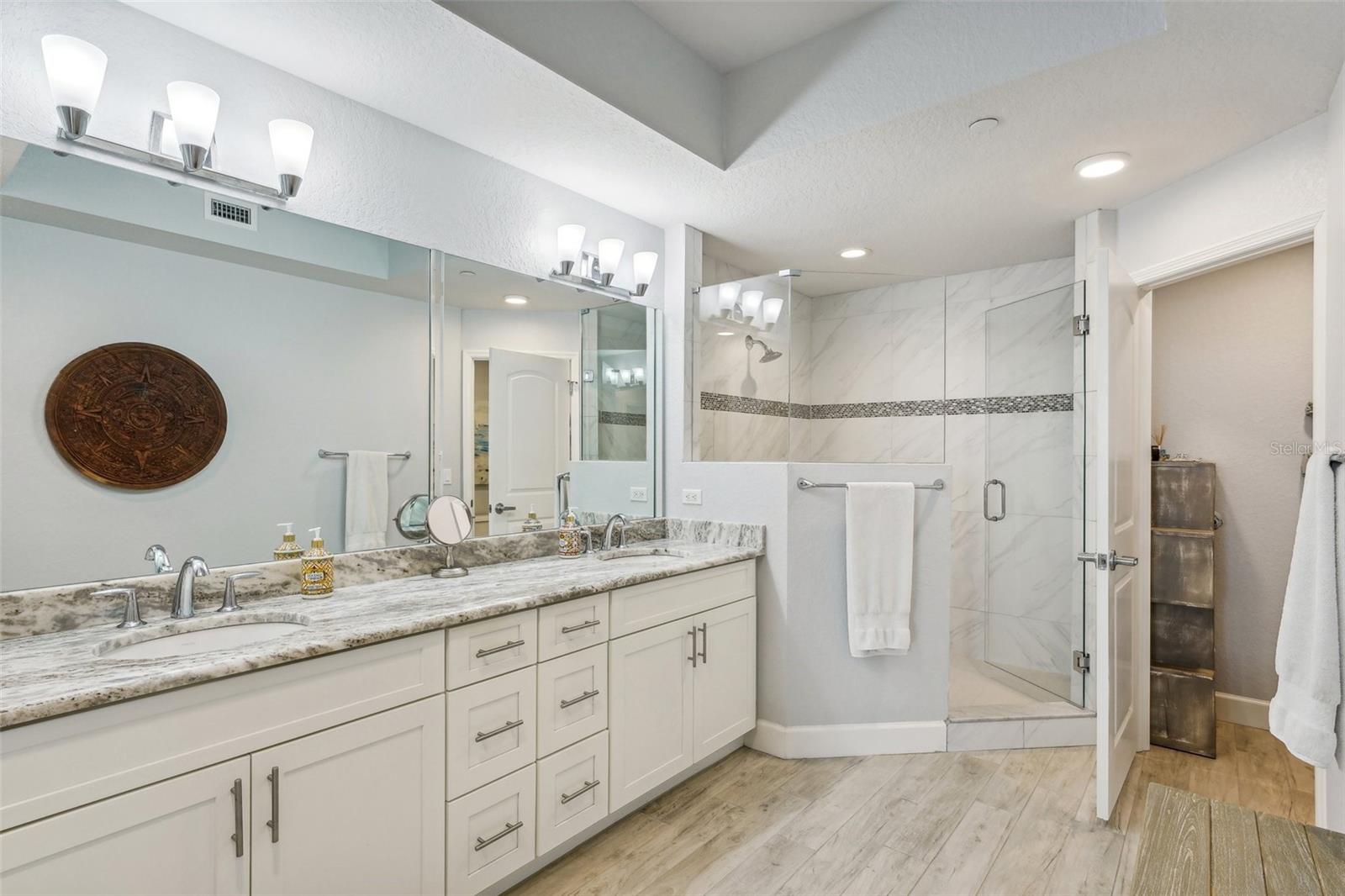 Dual vanities and very large walk-in shower.