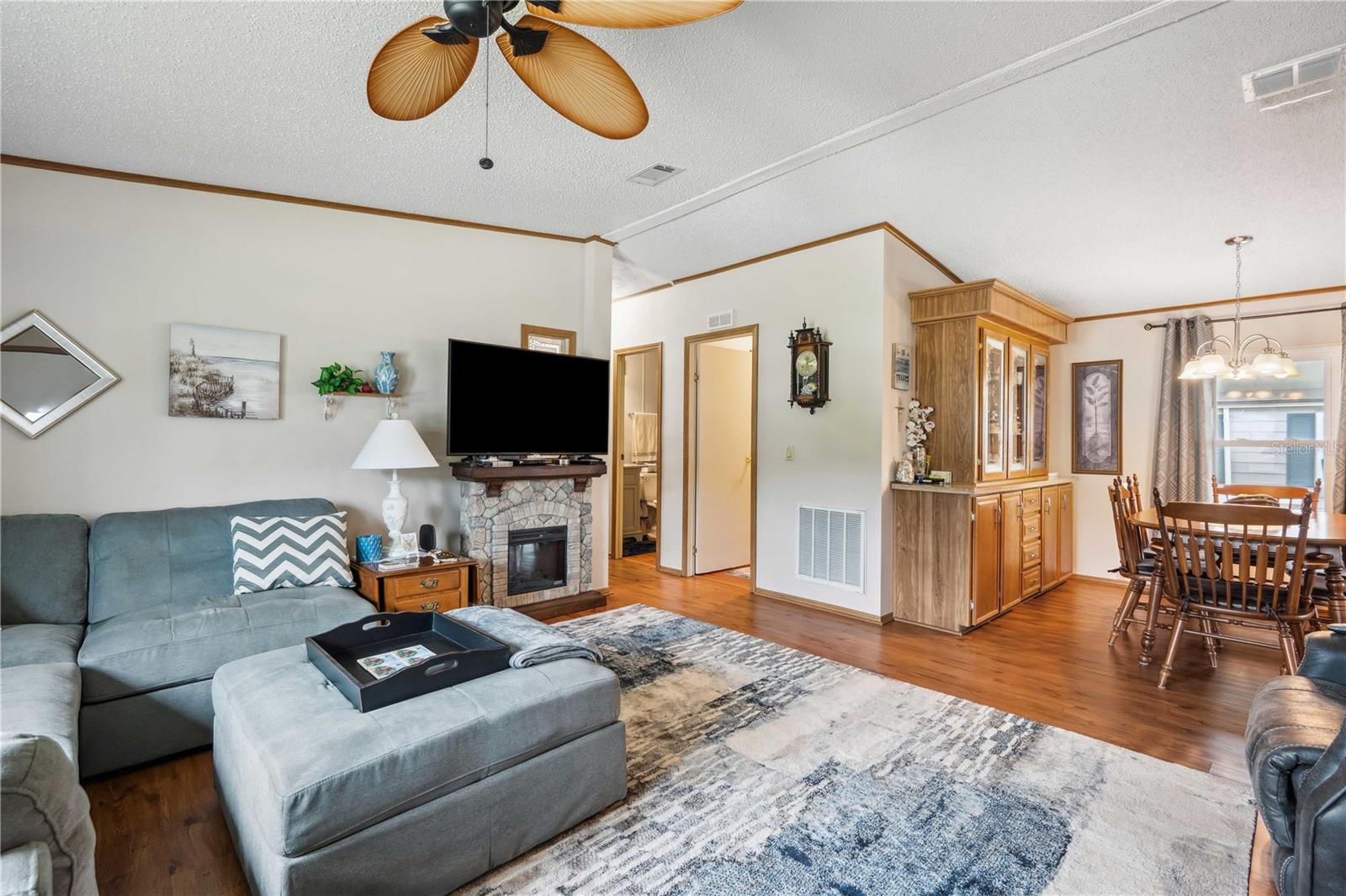 This kitchen has Granite counter tops, wood cabinets, updated fixtures, and luxury vinyl plank flooring.