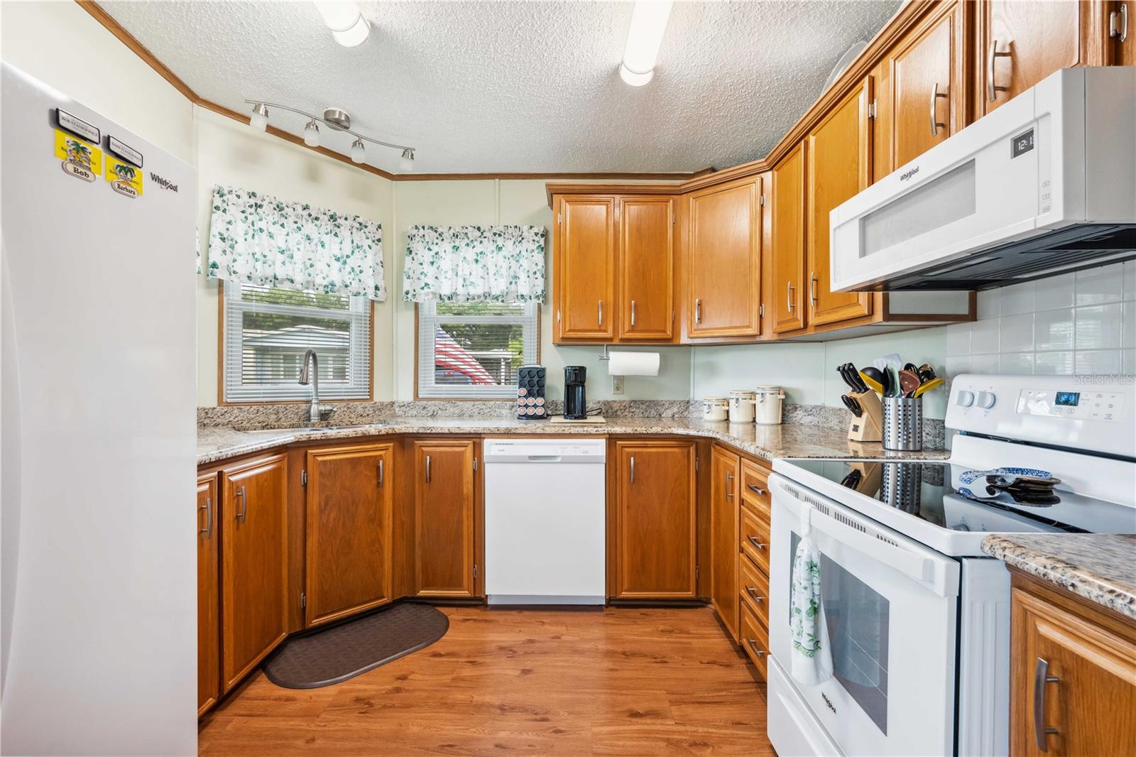 Primary retreat has plenty of space with Granite counter tops, including makeup vanity, new lighting fixtures, and much more,