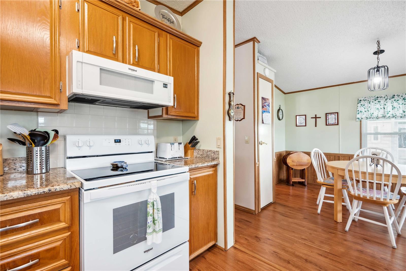 Bedroom two has ceiling fan, walk-in closet, and updated luxury vinyl plank flooring.