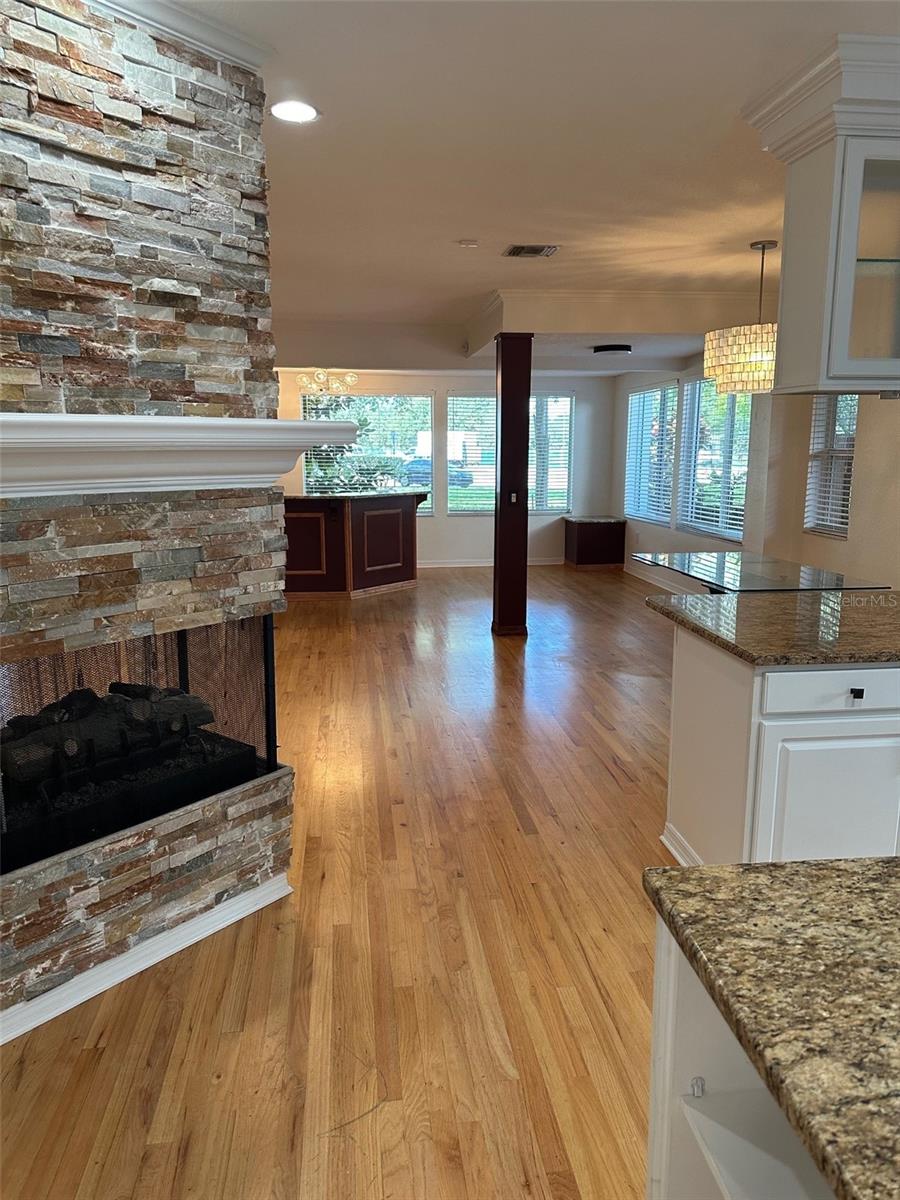 view of bar and dining areas from kitchen