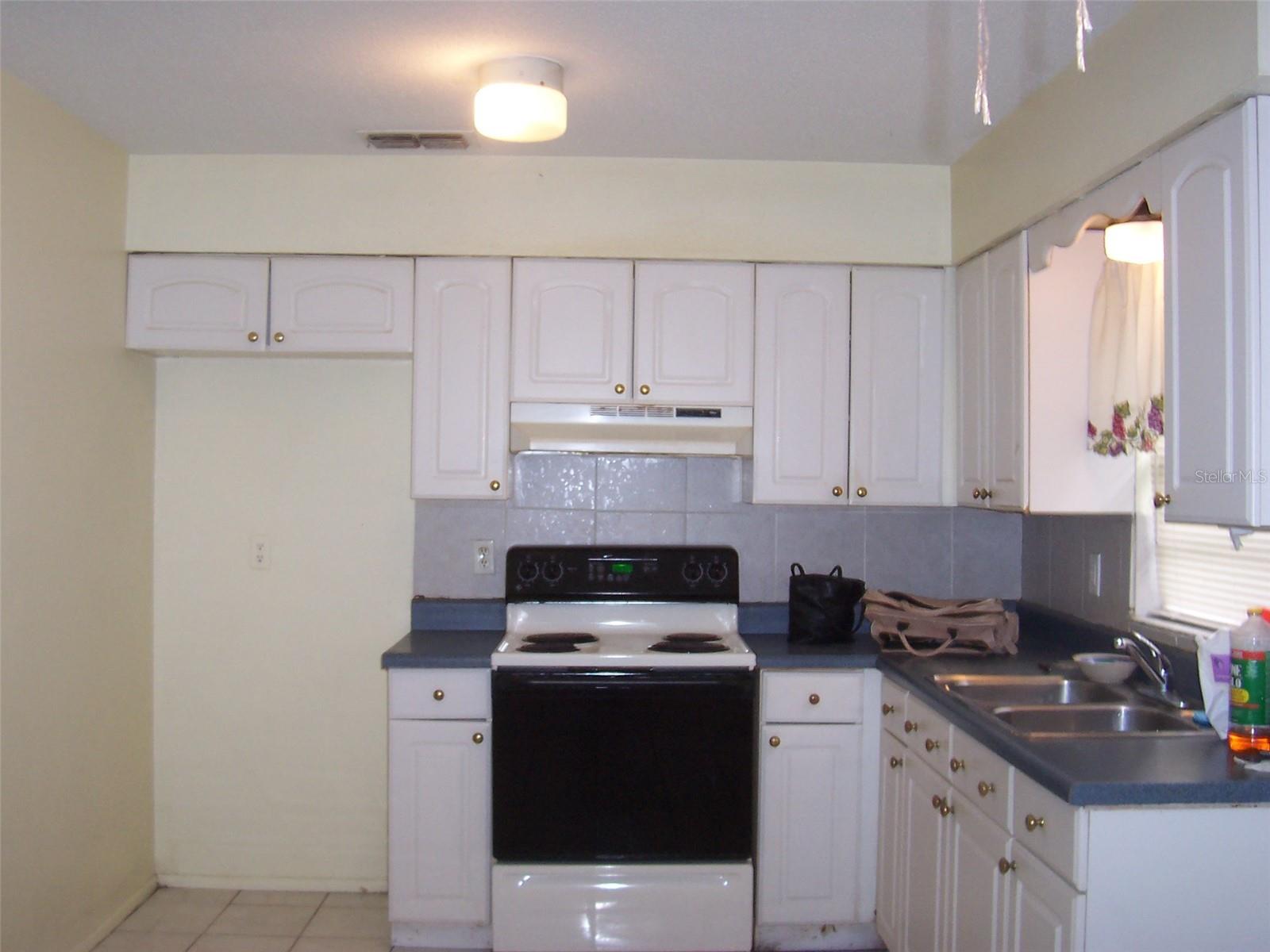 Nice kitchen with nice white cabinets.