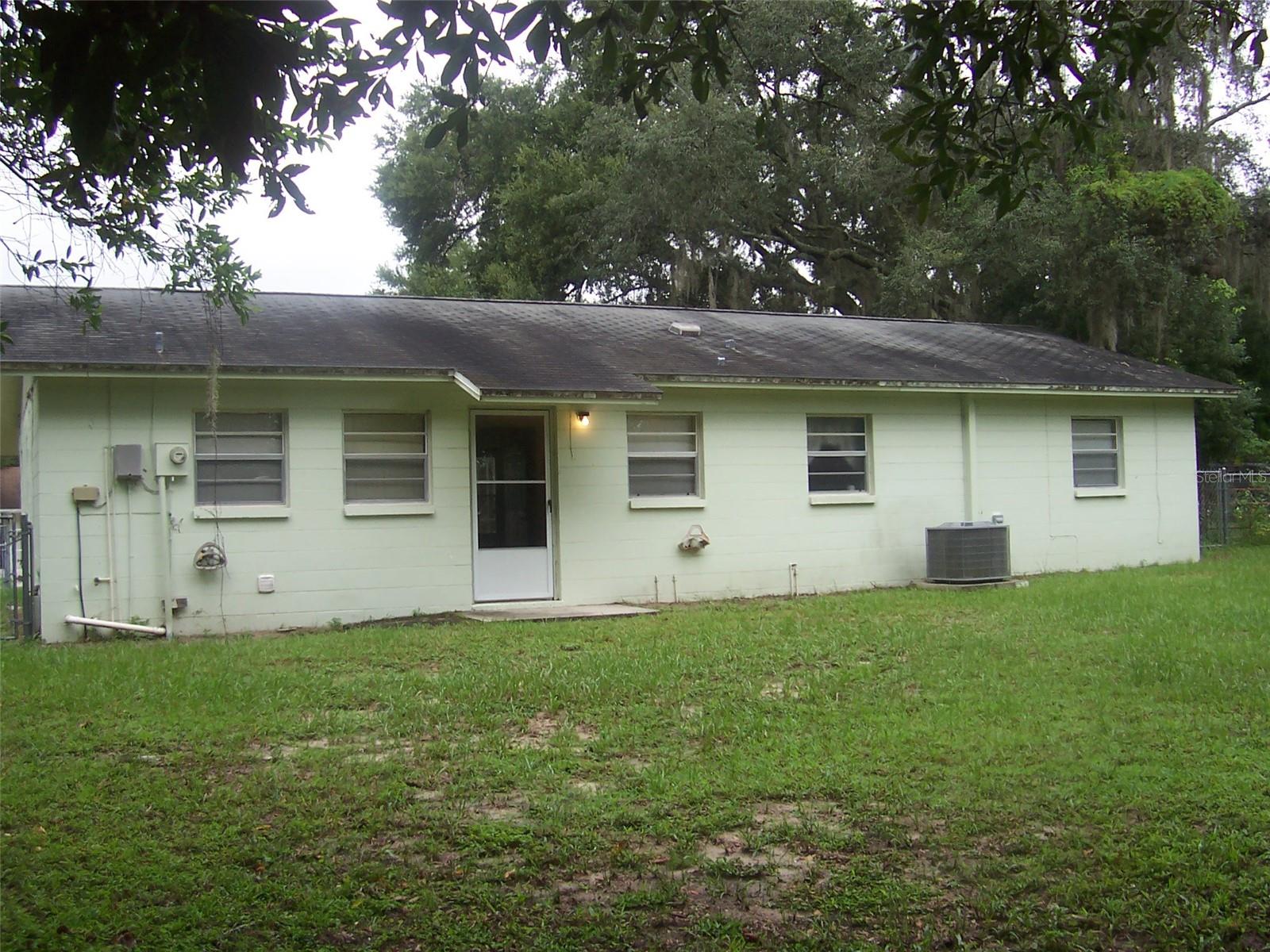 Back of home showing back door that enters into Dining Room