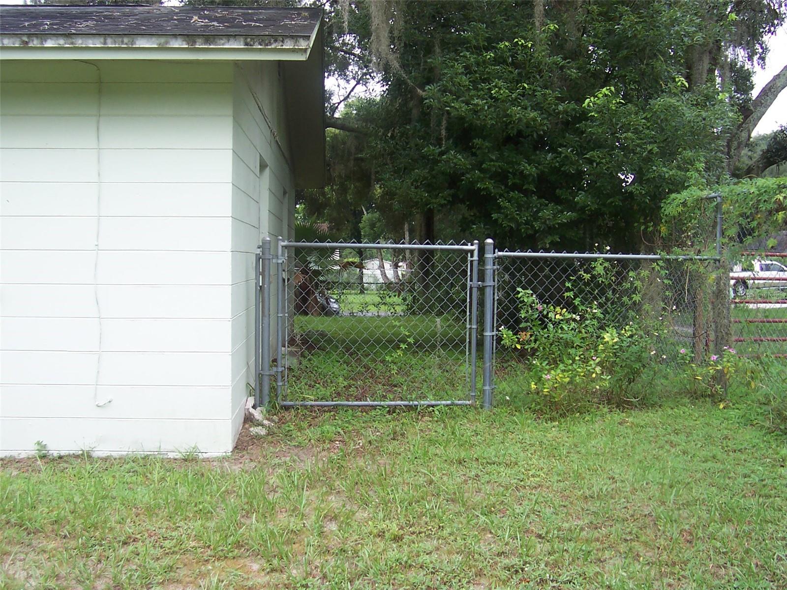 Both sides of home have service gates to the back yard.  Great Convenience.  Completely fenced front and back yard.