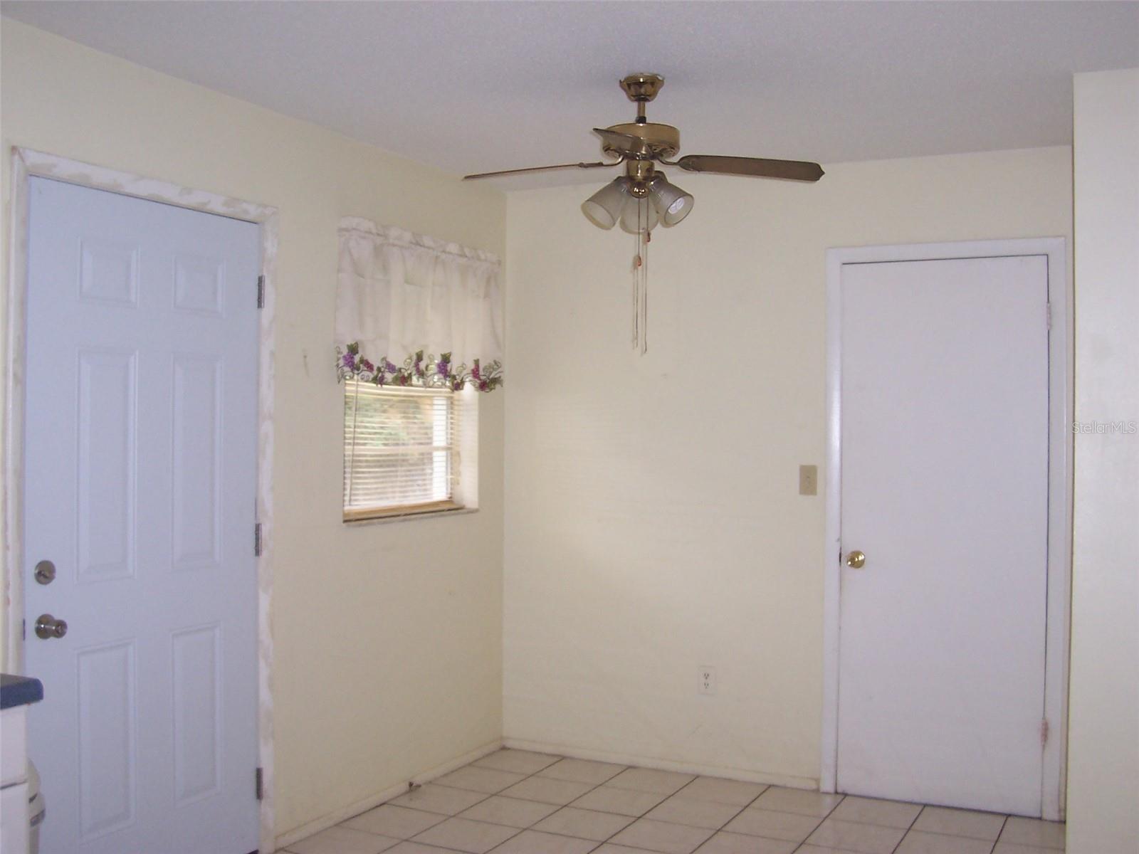 Dining Area showing door to laundry room and door to back yard.