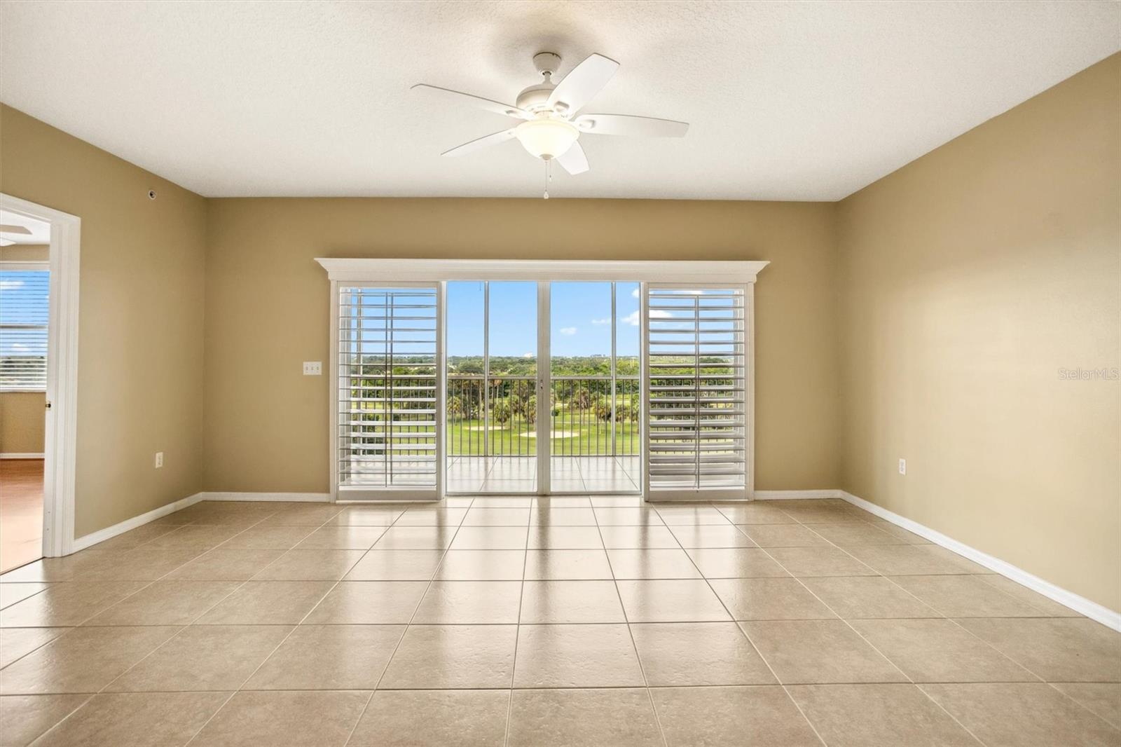 Wall of windows with plantation shutters