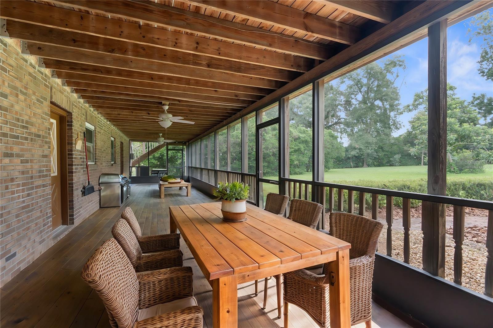 Virtually staged back, screened in Florida room