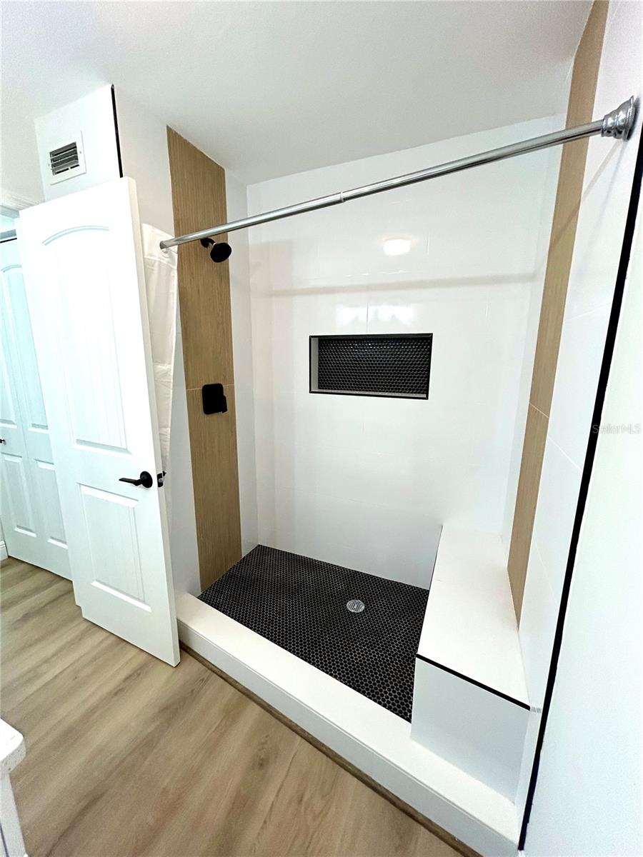 Primary Bathroom shower with bench