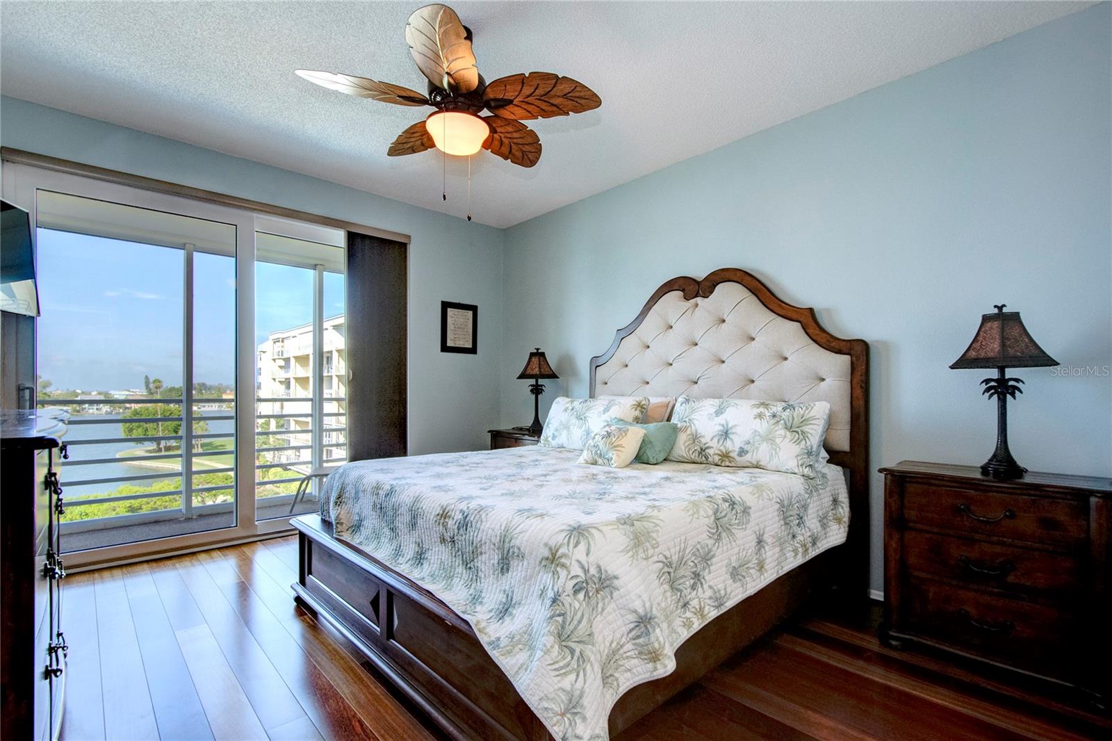 Primary bedroom with view and access to balcony