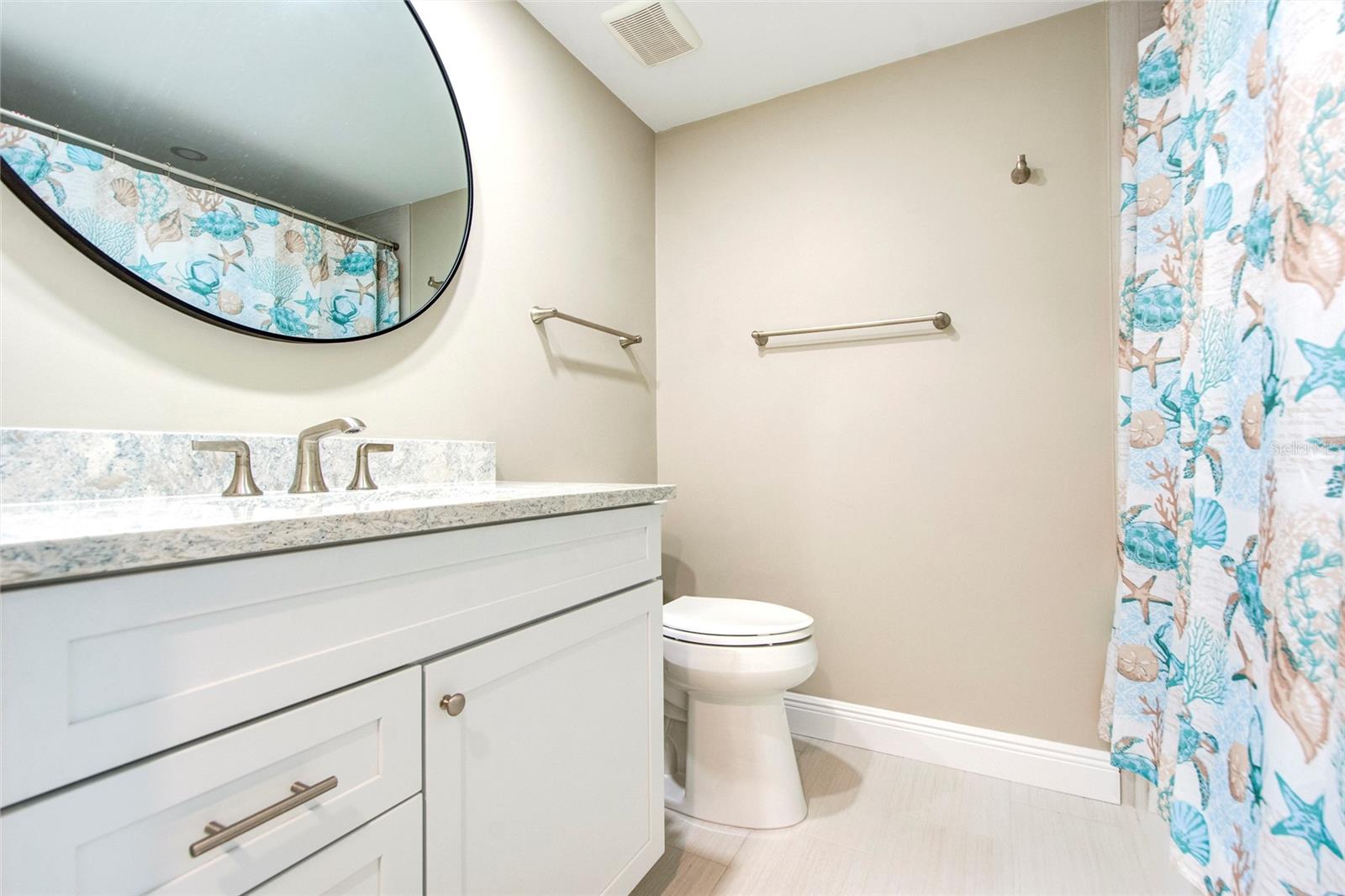 Guest bathroom has tub