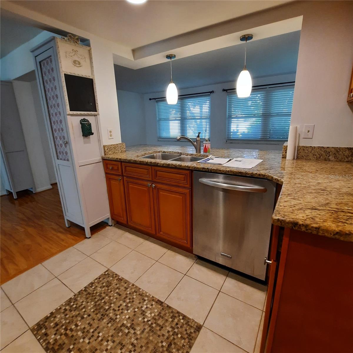 Kitchen counter/pass thru with counter in family room.