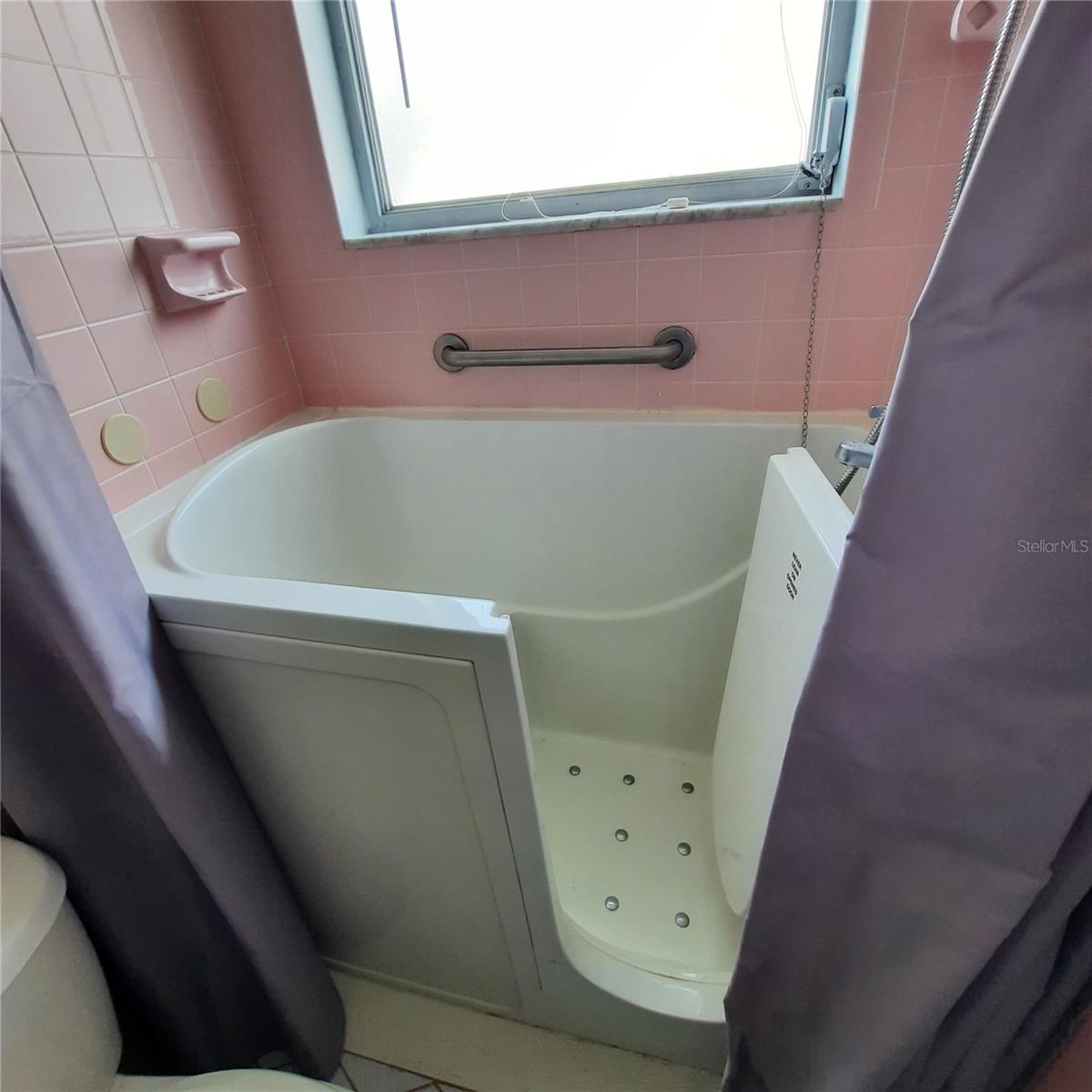 sit-up tub and shower in ensuite bath.