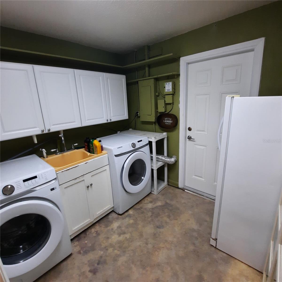 Inside Laundry Room with utility sink