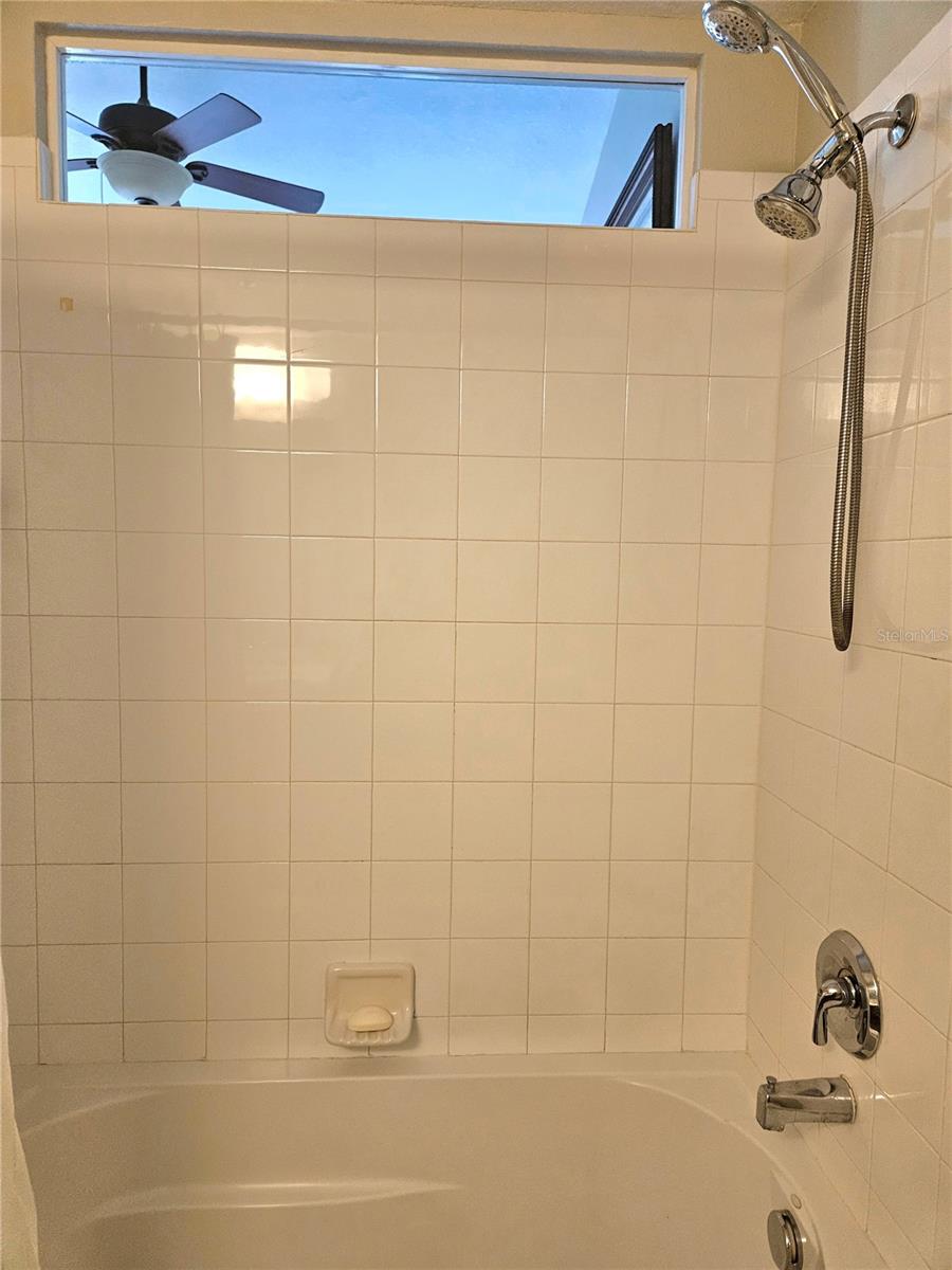 Tub/Shower with Glass Insert to Primary Bedroom