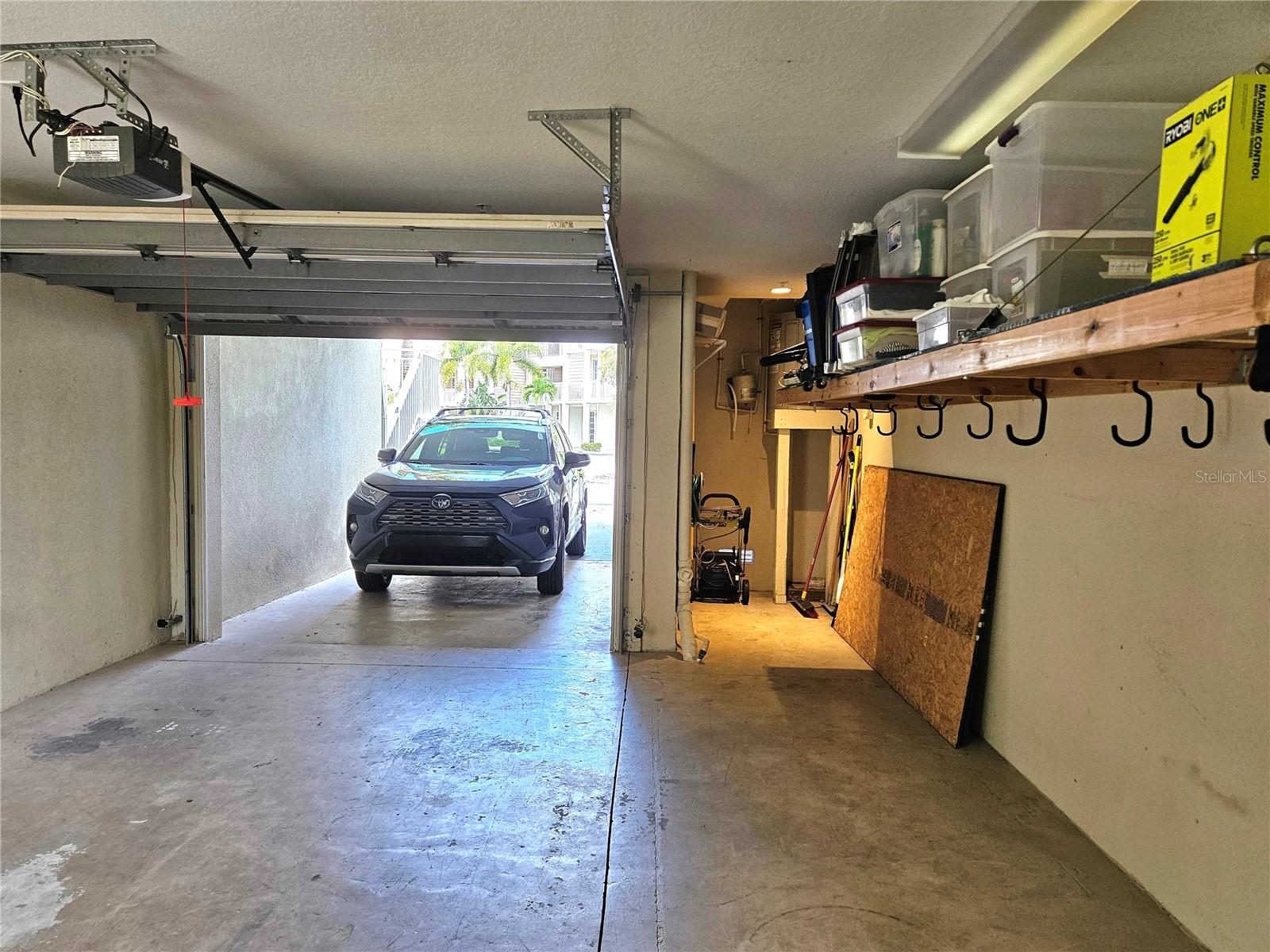 Single Car Garage, Additional Covered Carport and Driveway