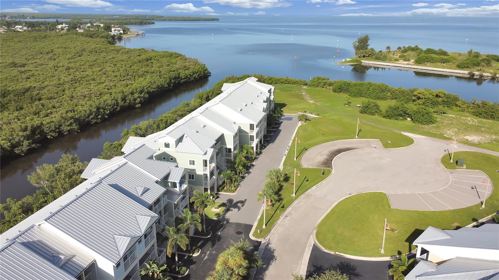 View of Cul-de-Sac with Guest Parking Spaces and Canal to Tampa Bay and 2nd Marina