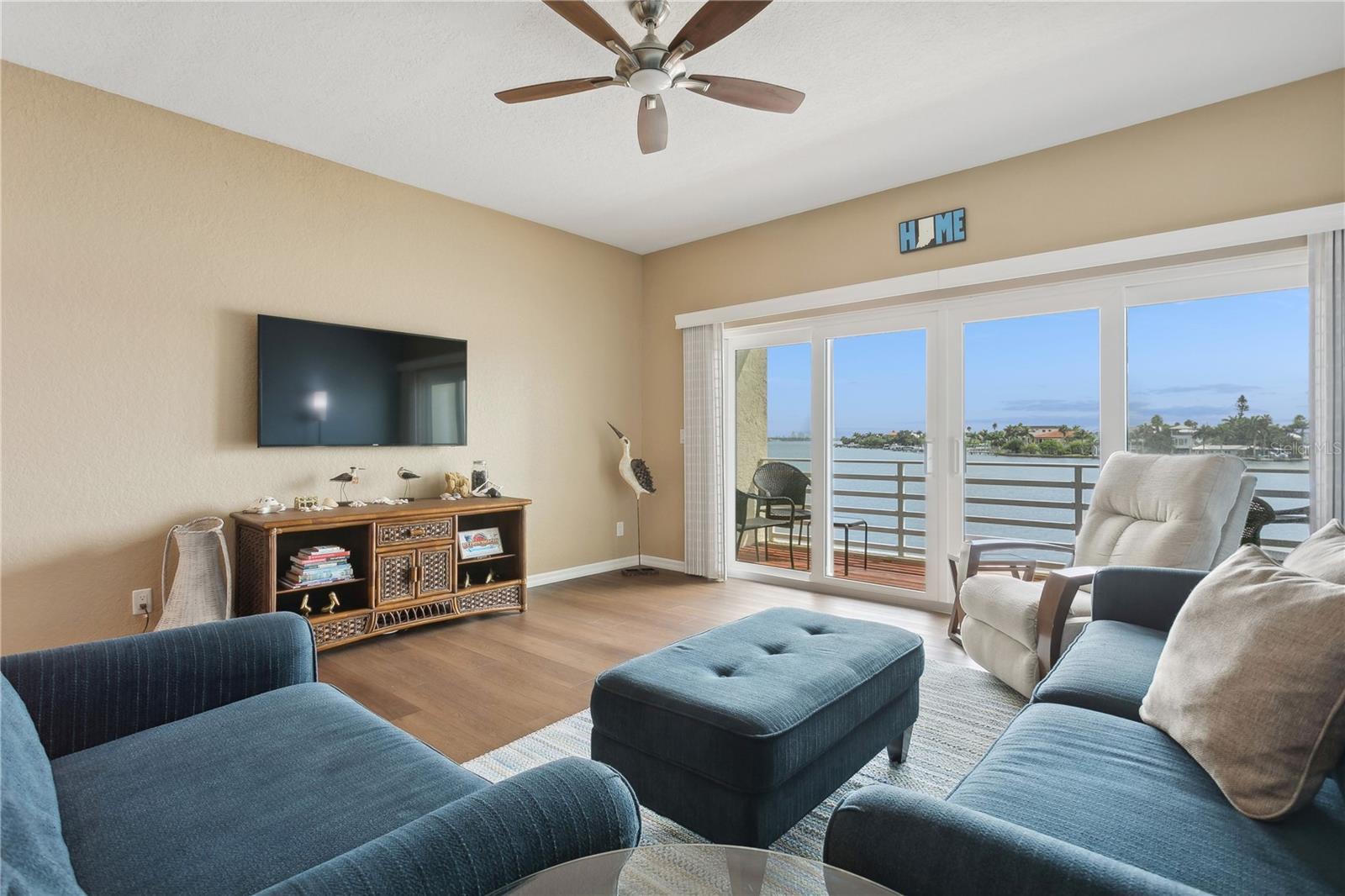 Open living room with high ceilings and views of Boca Ciega