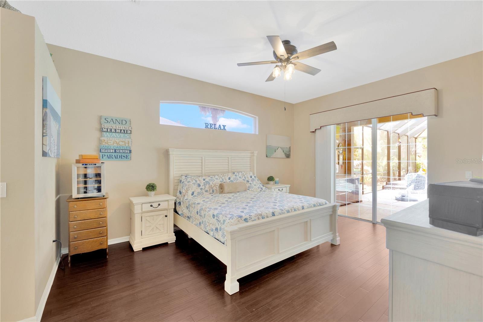 Primary En Suite features walk-in closets, primary bath, and access to the lanai!