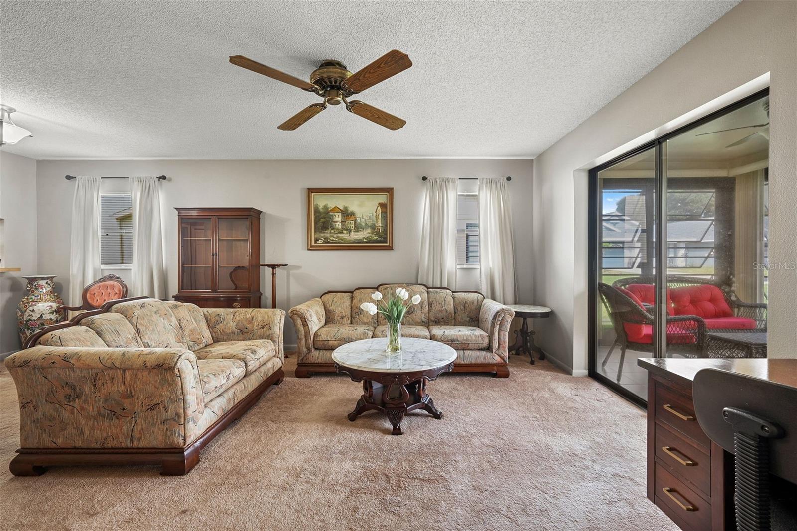 Living room with view to the screened lanai