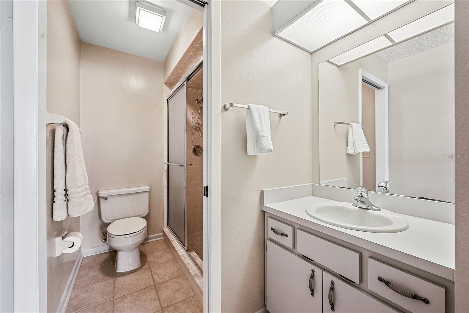 Ensuite bathroom in primary bedroom with walk-in shower